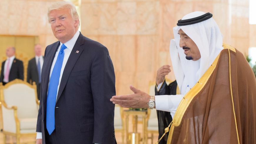 Saudi Arabia's King Salman bin Abdulaziz Al Saud welcomes U.S. President Donald Trump during a reception ceremony in Riyadh, Saudi Arabia, May 20, 2017. Bandar Algaloud/Courtesy of Saudi Royal Court/Handout via REUTERS ATTENTION EDITORS - THIS PICTURE WAS PROVIDED BY A THIRD PARTY. FOR EDITORIAL USE ONLY. - RTX36OPZ