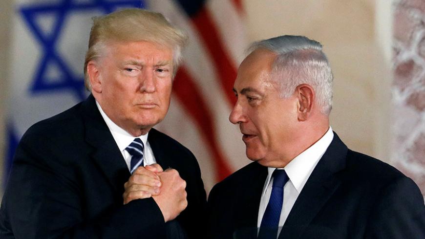 U.S. President Donald Trump and Israeli Prime Minister Benjamin Netanyahu shake hands after Trump's address at the Israel Museum in Jerusalem May 23, 2017. REUTERS/Ronen Zvulun     TPX IMAGES OF THE DAY - RTX376XD