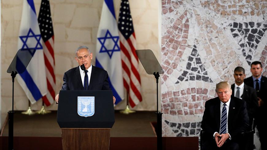 U.S. President Donald Trump (R) listens as Israeli Prime Minister Benjamin Netanyahu speaks at the Israel Museum in Jerusalem May 23, 2017. REUTERS/Ronen Zvulun - RTX3774K