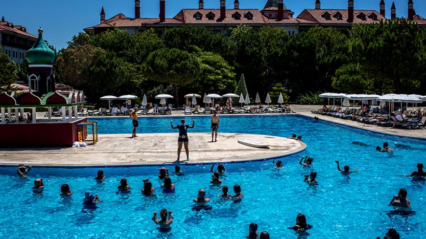 ANTALYA, TURKEY - JULY 12: Tourists take part in an aqua aerobics session at an all inclusive Russian themed resort on July 12, 2016 in Antalya, Turkey. Russian President Vladimir Putin last month officially lifted travel restrictions on tourism to Turkey. Russia had banned agency tours to Turkey after a diplomatic crisis erupted when Turkey downed a Russian jet on the Turkey - Syrian border in November 2015.  Turkey's tourism is currently in crisis after a series of terrorist attacks, most recently the bom