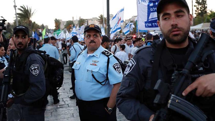 A picture taken on May 24, 2017 shows the Chief of the Israeli police, Commissioner Roni Alsheikh (C) during the Jerusalem Day march in Jerusalem. 
Alsheikh is the former deputy chief of the Israel Security Agency (Shin Bet). / AFP PHOTO / THOMAS COEX        (Photo credit should read THOMAS COEX/AFP/Getty Images)