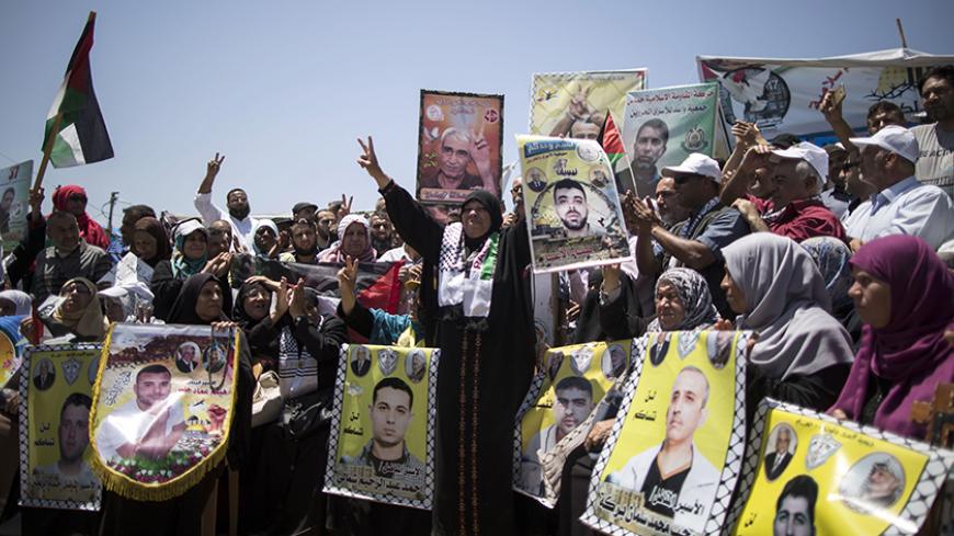 Palestinians take part in rally in support of Palestinian prisoners held in Israeli jails who ended their hunger strike earlier in the day, in Gaza City on May 27, 2017.
Hundreds of Palestinian prisoners in Israeli jails on hunger strike since April 17 have ended their mass protest after Israel agreed a deal following weeks of refusing to negotiate, sources on both sides said / AFP PHOTO / MAHMUD HAMS        (Photo credit should read MAHMUD HAMS/AFP/Getty Images)