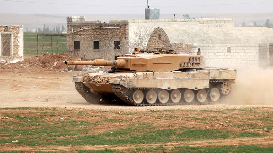 A Turkish tank drives east of al-Bab town, Syria March 9, 2017. REUTERS/Khalil Ashawi - RTS126RR
