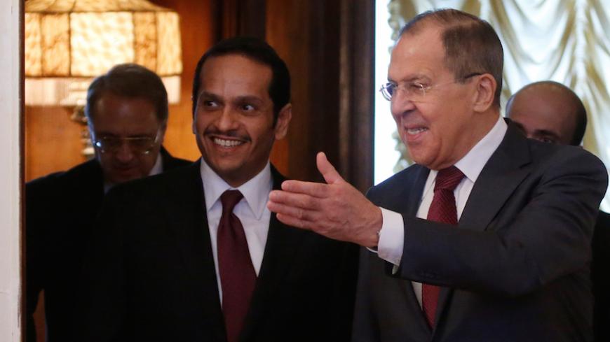 Russian Foreign Minister Sergei Lavrov and Qatari Foreign Minister Sheikh Mohammed bin Abdulrahman bin Jassim Al-Thani enter a hall during their meeting in Moscow, Russia, April 15, 2017. REUTERS/Maxim Shemetov - RTS12E5Q