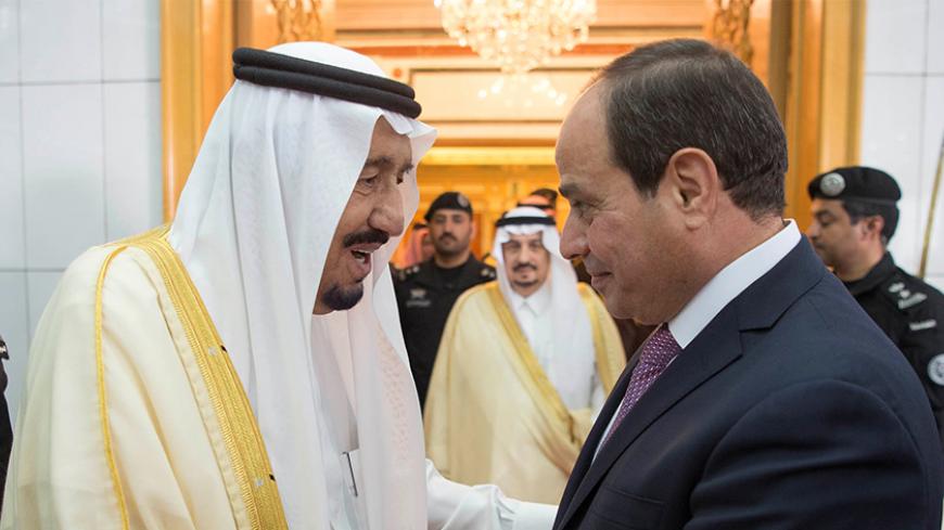 Saudi Arabia's King Salman bin Abdulaziz Al Saud (L) shakes hands with Egypt's President Abdel Fattah al-Sisi in Riyadh in Riyadh, Saudi Arabia April 23, 2017. Bandar Algaloud/Courtesy of Saudi Royal Court/Handout via REUTERS ATTENTION EDITORS - THIS PICTURE WAS PROVIDED BY A THIRD PARTY. FOR EDITORIAL USE ONLY. - RTS13JDG