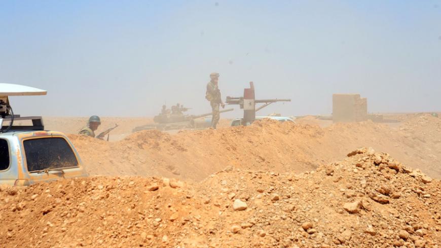 Forces loyal to Syria's President Bashar al-Assad take positions in the Badia, in the southeast Syrian desert, in this handout picture provided by SANA on June 13, 2017, Syria. SANA/Handout via REUTERS ATTENTION EDITORS - THIS PICTURE WAS PROVIDED BY A THIRD PARTY. REUTERS IS UNABLE TO INDEPENDENTLY VERIFY THE AUTHENTICITY, CONTENT, LOCATION OR DATE OF THIS IMAGE. - RTS16TU2