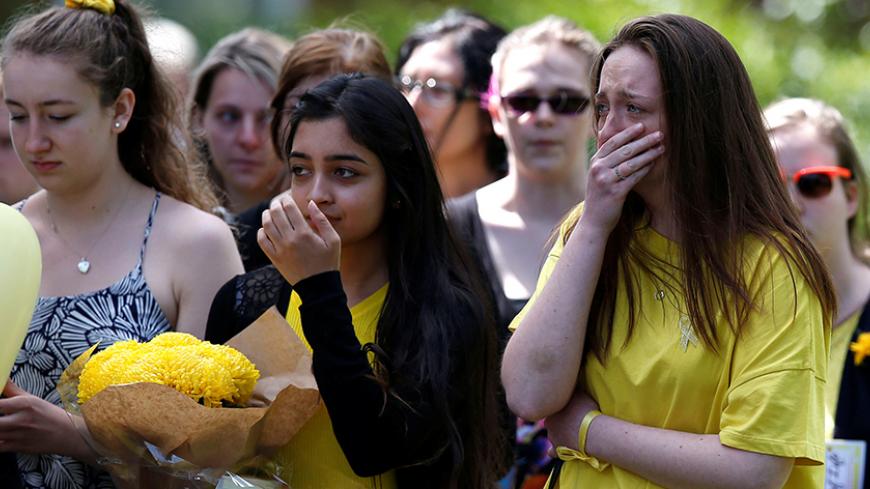 Mourners arrive for the funeral of Manchester bomb victim Georgina Callander at Holly Trinity Church, Tarleton, Britain, June 15, 2017. REUTERS/Andrew Yates