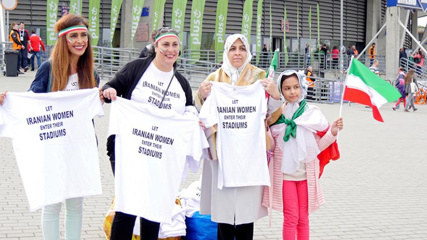 Women hold t-shirts as they protest for Iranian women's rights to enter stadiums in Iran, ahead of the FIVB Volleyball World League match between Poland and Iran, at Atlas Arena in Lodz, Poland June 17, 2017. REUTERS/Parham Ghobadi - RTS17HJ6