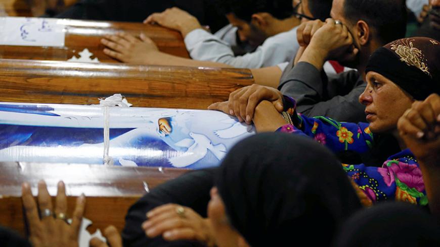 Mourners gather at the Sacred Family Church for the funeral of Coptic Christians who were killed in Minya, Egypt, May 26, 2017. Picture taken May 26, 2017. REUTERS/Mohamed Abd El Ghany - RTS17MF0