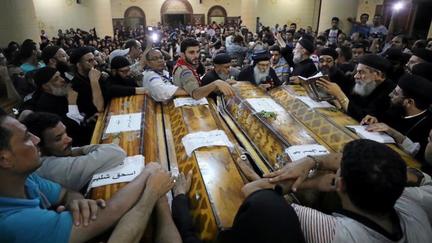 Mourners gather at the Sacred Family Church for the funeral of Coptic Christians who were killed in Minya, Egypt, May 26, 2017. Picture taken May 26, 2017. REUTERS/Mohamed Abd El Ghany - RTS17MF1