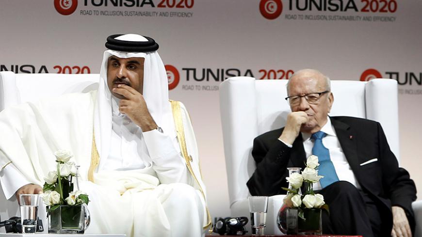 Tunisia's President Beji Caid Essebsi (R), Qatar's Emir Sheikh Tamim bin Hamad Al-Thani (C) and President of the Assembly of People's Representatives Mohamed Ennaceur attend the opening of international investment conference Tunisia 2020, in Tunis, Tunisia November 29, 2016. REUTERS/Zoubeir Souissi - RTSTT1D