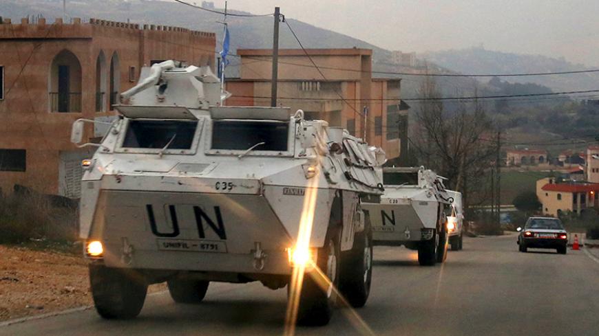U.N. peacekeepers of the United Nations Interim Force in Lebanon (UNIFIL) patrol on their armored vehicles near Adaisseh village near the Lebanese-Israeli border, southern Lebanon, January 4, 2016. Hezbollah said it set off a bomb targeting Israeli forces at the Lebanese border on Monday in an apparent response to the killing in Syria last month of a prominent commander, triggering Israeli shelling of southern Lebanon. REUTERS/Aziz Taher - RTX2101D