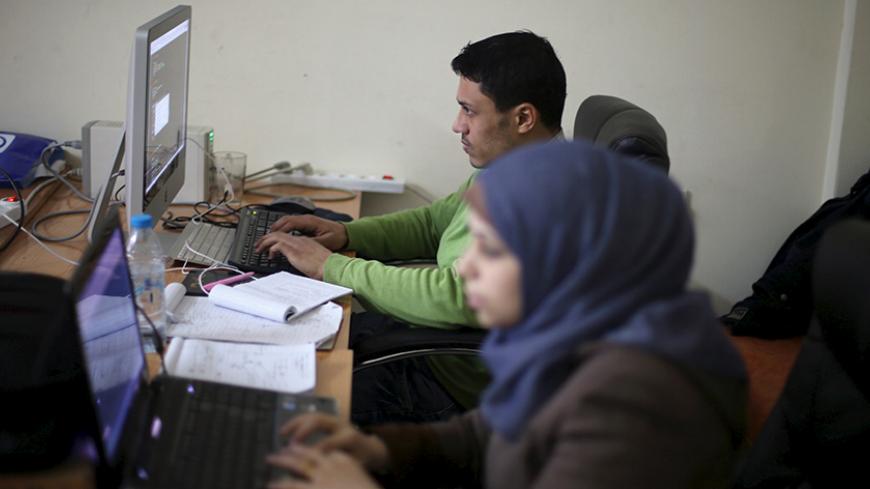 Young Palestinian entrepreneurs use their computers at Gaza Sky Geeks office, in Gaza City January 18, 2016. Picture taken January 18, 2016. REUTERS/Ibraheem Abu Mustafa  - RTX242SL