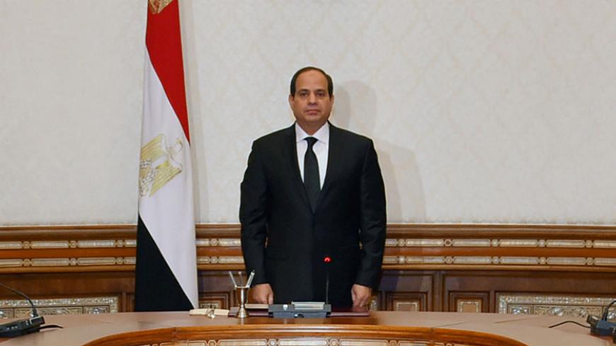 Egyptian President Abdel Fattah al-Sisi stands and observes a minute of silence for the victims of two separate church attacks during Palm Sunday prayers, with leaders of the Supreme Council of the Armed Forces and the Supreme Council for Police to discuss developments in the security situation in Egypt, as well as developments in the country's fight against terrorism, at the Ittihadiya presidential palace in Cairo, Egypt, April 9, 2017, in this handout picture courtesy of the Egyptian Presidency. The Egypt