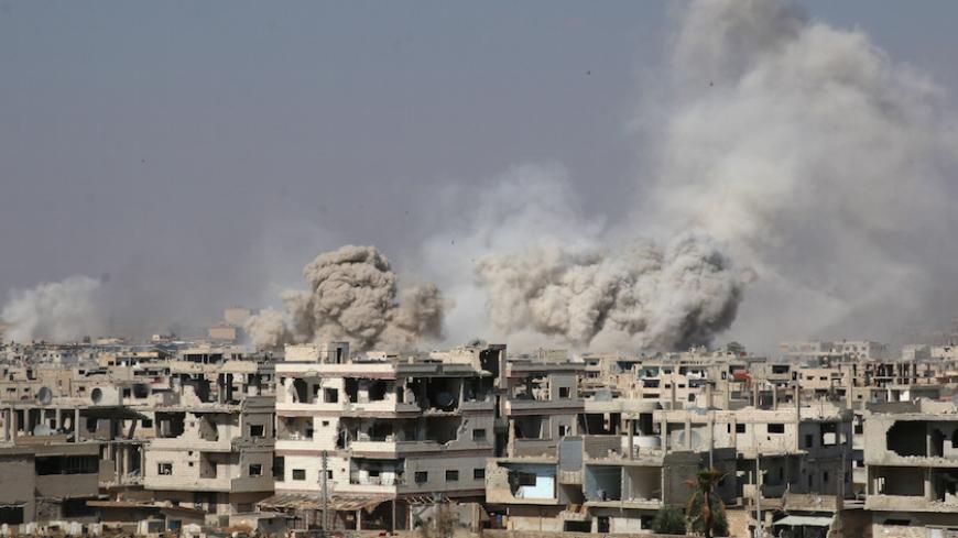 Smoke rises after shelling on a rebel-held area of Deraa, Syria, June 4, 2017. REUTERS/Alaa Al-Faqir - RTX3909A