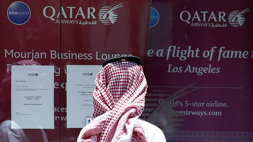 A man stands outside Qatar Airways office in Riyadh, Saudi Arabia, June 5, 2017. REUTERS/Faisal Al Nasser - RTX392F7