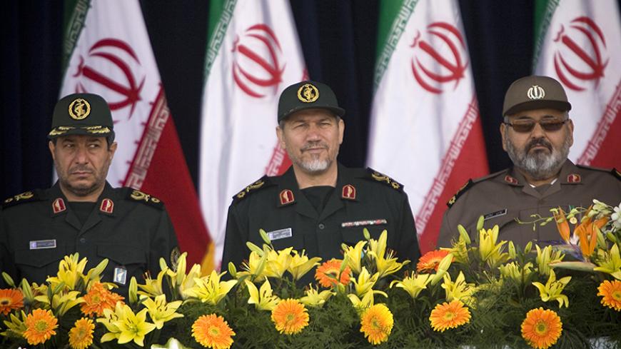 Iran's Defence Minister Mostafa Mohammad Najjar (L), Former Revolutionary Guards commander Yahya Rahim Safavi (C) and Chief of Staff of Iran Armed Forces General Hassan Firoozabadi attend a military parade to commemorate the anniversary of army day in Tehran, April 18, 2009. President Mahmoud Ahmadinejad 
said on Saturday a strong Iranian military would help preserve stability in the Middle East, as Iran marked its armed forces' day with a parade that appeared more muted than in the past.
REUTERS/Morteza Ni