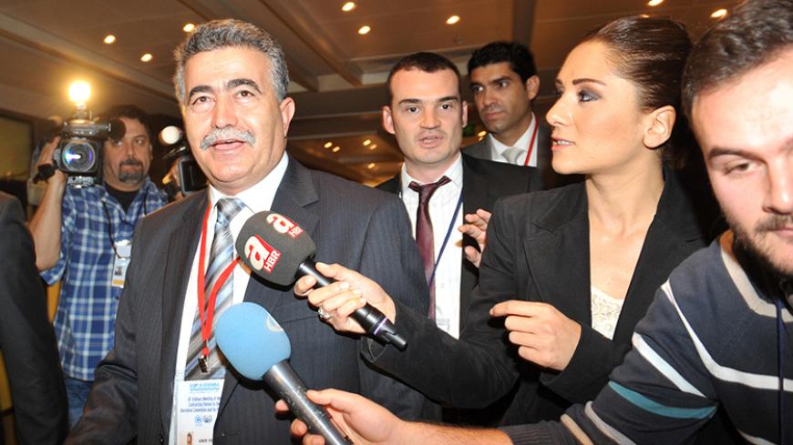 Israel's Environment Minister Amir Peretz (L) is surrounded by journalists during the 18th ordinary meeting of contracting parties to the Barcelona convention and its protocols on December 5 2013 in istanbul. It is the first such trip of an Israeli cabinet minister in Turkey since the rupture of relations between the two former allies over a deadly raid on a Gaza-bound flotilla. Ties between Israel and Turkey hit an all-time low in May 2010 when Israeli commandos staged a pre-dawn raid on a flotilla of ship