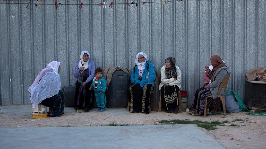 Bedouin women sit next to their makeshift home on November 22, 2016 in the village of Umm Al-Hiran village, which is not recognized by the Israeli government, near the southern city of Beersheba in the Negev desert.
In May 2015, Israel's Supreme Court approved the removal of 750-1,000 Bedouin residents from Umm al-Hiran to enable the construction of a Jewish town. According to Human Rights Watch, the villagers say they were expelled from their land in 1948, when the state of Israel was established, and whil