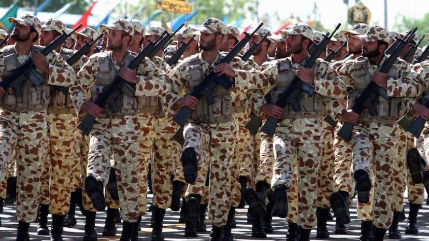 Iranian soldiers march during a parade marking the country's Army Day, on April 18, 2017, in Tehran. / AFP PHOTO / ATTA KENARE        (Photo credit should read ATTA KENARE/AFP/Getty Images)