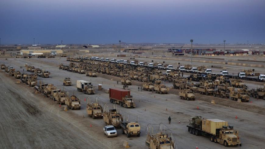 Vehicles of the 3rd Brigade Combat Team, 1st Cavalry Division line up for the departure of the final convoy of U.S. military forces out of Iraq at Camp Adder near Nasiriyah, Iraq on December 17, 2011. REUTERS/Lucas Jackson/Pool (IRAQ - Tags: MILITARY CONFLICT POLITICS) - RTR2VDWN