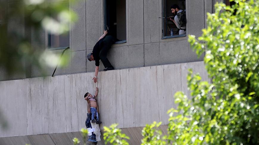 Two-year-old Emad is evacuated during an attack on the Iranian parliament in central Tehran, Iran, June 7, 2017. Omid Vahabzadeh/TIMA via REUTERS/ File Photo ATTENTION EDITORS - THIS IMAGE WAS PROVIDED BY A THIRD PARTY. FOR EDITORIAL USE ONLY.   THIS PICTURE WAS PROCESSED BY REUTERS TO ENHANCE QUALITY. AN UNPROCESSED VERSION HAS BEEN PROVIDED SEPARATELY.      SEARCH "IRAN EMAD" FOR THIS STORY. SEARCH "WIDER IMAGE" FOR ALL STORIES.   TPX IMAGES OF THE DAY       TPX IMAGES OF THE DAY - RTS181NE