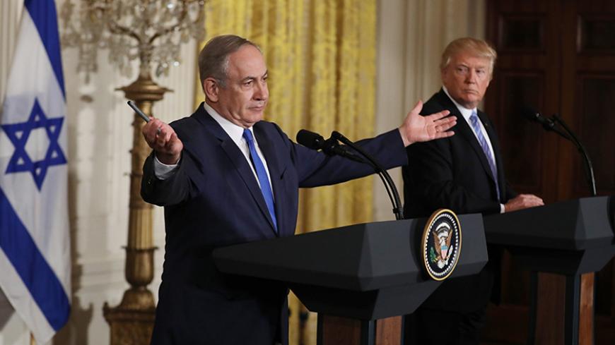 Israeli Prime Minister Benjamin Netanyahu addresses a joint news conference with U.S. President Donald Trump (R) at the White House in Washington, U.S., February 15, 2017.   REUTERS/Carlos Barria -TPX IMAGES OF THE DAY)   - RTSYTXW
