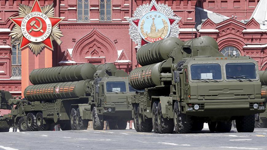 Russian S-400 air defence mobile missile launching systems drive during a rehearsal for the Victory Day parade in Red Square in central Moscow, Russia, May 7, 2015. Russia will celebrate the 70th anniversary of the victory over Nazi Germany in World War Two on May 9. REUTERS/Grigory Dukor  - RTX1BY6F