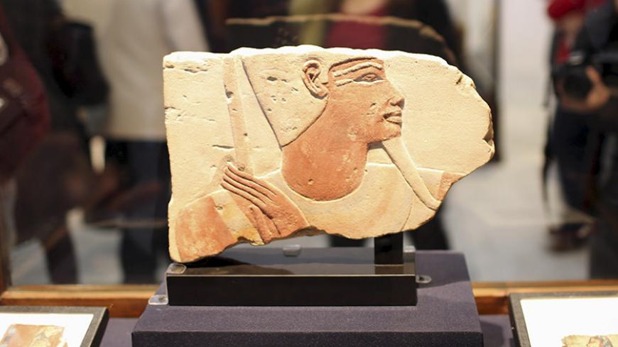 A fragment of an ancient Egyptian artifact is displayed at the opening of the "Repatriated Objects Temporary Exhibition" at the Egyptian museum in Cairo, January 14, 2016. The exhibition features more than a hundred antiquities returned from France, the United States, Germany, the United Kingdom, Denmark, Austria, Belgium and South Africa. REUTERS/Asmaa Waguih - RTX22DIA