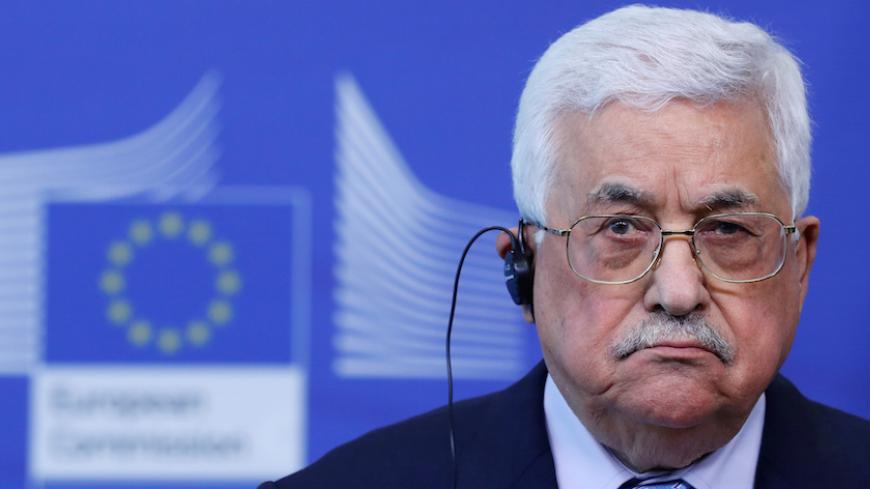 Palestinian President Mahmoud Abbas (L) holds a news conference after a meeting with European Union foreign policy chief Federica Mogherini in Brussels, Belgium, March 27, 2017. REUTERS/Yves Herman - RTX32WQI