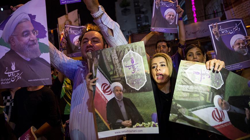 Supporters of Iran's President Hassan Rouhani hold his posters during a campaign rally in Tehran, Iran, May 17, 2017. Picture taken  May 17, 2017. TIMA via Reuters ATTENTION EDITORS - THIS IMAGE WAS PROVIDED BY A THIRD PARTY. FOR EDITORIAL USE ONLY. - RTX36BFG