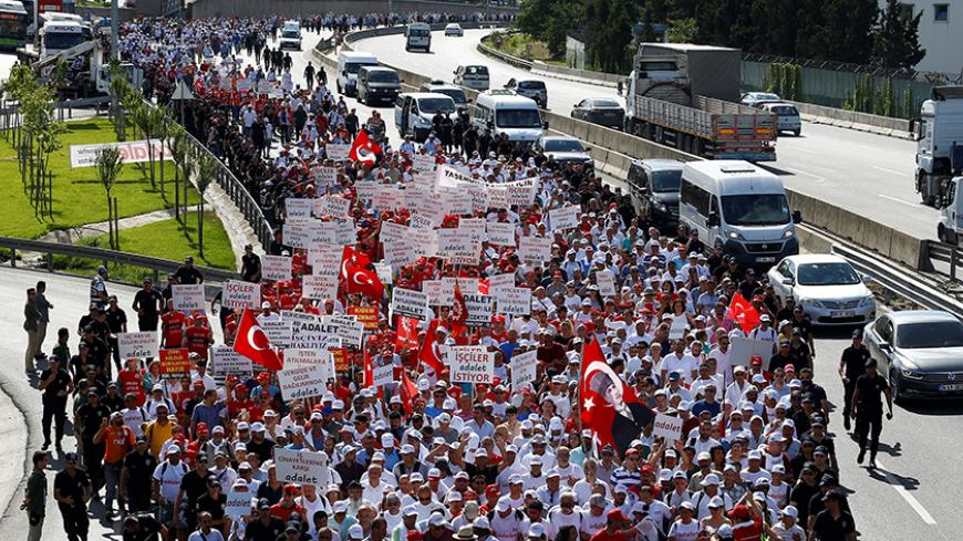 Supporters of Turkey's main opposition Republican People's Party (CHP) leader Kemal Kilicdaroglu walk during the 22nd day of a protest, dubbed "justice march", against the detention of the party's lawmaker Enis Berberoglu, near Dilovası in Kocaeli province, Turkey, July 6, 2017. REUTERS/Osman Orsal - RTX3A9RJ