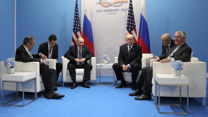 U.S. President Donald Trump (3rd R), Secretary of State Rex Tillerson (R), Russian President Vladimir Putin (3rd L) and Foreign Minister Sergei Lavrov (L) attend a meeting on the sidelines of the G20 summit in Hamburg, Germany July 7, 2017 Sputnik/Mikhail Klimentyev/Kremlin via REUTERS ATTENTION EDITORS - THIS IMAGE WAS PROVIDED BY A THIRD PARTY. EDITORIAL USE ONLY. - RTX3AIRY
