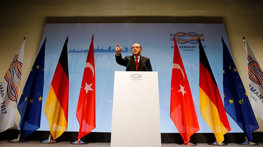 Turkish President Recep Tayyip Erdogan gestures during a news conference to present the outcome of the G20 leaders summit in Hamburg, Germany July 8, 2017. REUTERS/Wolfgang Rattay - RTX3ANEA
