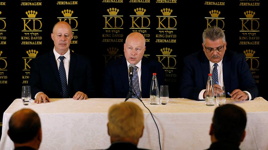 Jason Greenblatt (C), U.S. President Donald Trump's Middle East envoy, sits next to Tzachi Hanegbi (L), Israeli Minister of Regional Cooperation and Mazen Ghoneim, head of the Palestinian Water Authority, during a news conference in Jerusalem July 13, 2017. REUTERS/Ronen Zvulun - RTX3B939