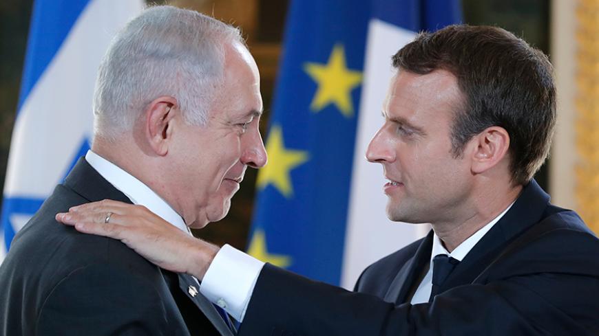 French President Emmanuel Macron and Israeli Prime Minister Benjamin Netanyahu react after making a joint declaration at the Elysee Palace in Paris, France, July 16, 2017. REUTERS/Stephane Mahe - RTX3BNWB