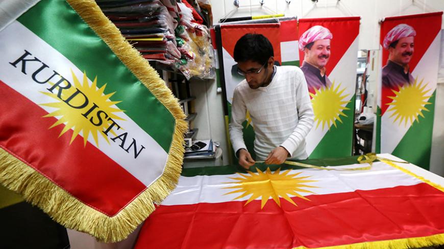 A man sews an Iraqi Kurdish flag bearing a portrait of Iraqi Kurdish leader Massud Barzani, in Arbil, the capital of the autonomous Kurdish region of northern Iraq, on February 3, 2016.  
Barzani has declared that the "time has come" for the country's Kurds to hold a referendum on statehood, his office said.

 / AFP / SAFIN HAMED        (Photo credit should read SAFIN HAMED/AFP/Getty Images)