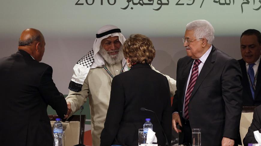 Palestinian president Mahmud Abbas (R) welcomes senior Hamas official, Ahmed Haj Ali (2nd-L) during the opening ceremony of the 7th Fatah Congress on November 29, 2016, at the Muqataa, the Palestinian Authority headquarters, in the West Bank city of Ramallah.
Abbas's Fatah re-elected him party head as the movement opened its first congress since 2009 with talk mounting of who will eventually succeed the 81-year-old.
 / AFP / ABBAS MOMANI        (Photo credit should read ABBAS MOMANI/AFP/Getty Images)