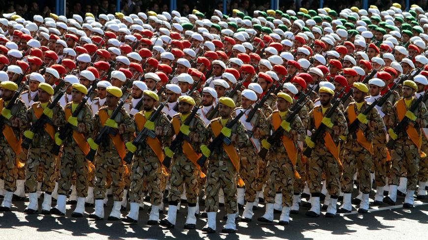 Iranian soldiers march during a parade marking the country's Army Day, on April 18, 2017, in Tehran. / AFP PHOTO / ATTA KENARE        (Photo credit should read ATTA KENARE/AFP/Getty Images)