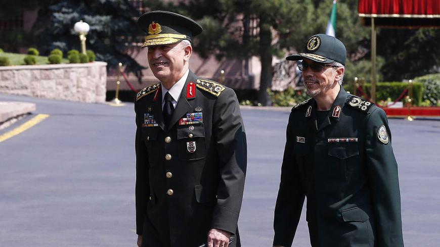 General Staff of the Armed Forces of Iran, Mohammad Bagheri (R) is welcomed by Chief of the General Staff of the Turkish Armed Forces Hulusi Akar during his official visit at the Turkish General Staff headquarters in Ankara, on August 15, 2017.   / AFP PHOTO / STR        (Photo credit should read STR/AFP/Getty Images)