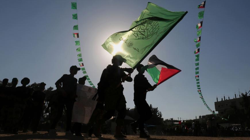 Young Palestinians march during in a military graduation ceremony at a Hamas summer camp in Khan Yunis, in the southern Gaza Strip, on August 18, 2017.
Hamas held a closing ceremony for a batch of the 120,000 boys and girls attending the Islamist movement's controversial summer schools. / AFP PHOTO / SAID KHATIB        (Photo credit should read SAID KHATIB/AFP/Getty Images)