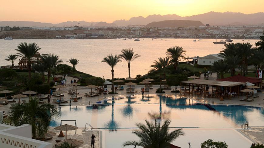 FILE PHOTO: A general view of Naama bay and a swimming pool of a hotel during sunset in the Red Sea resort of Sharm el-Sheikh, Egypt, November 7, 2015.    To match Special Report EGYPT-POLITICS/SINAI     REUTERS/Asmaa Waguih/File Photo - RTS14RT1