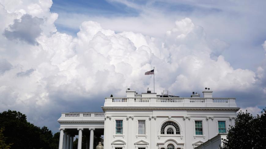 Clouds pass behind the White House in Washington, U.S., August 3, 2017.   REUTERS/Joshua Roberts - RTS1AASJ