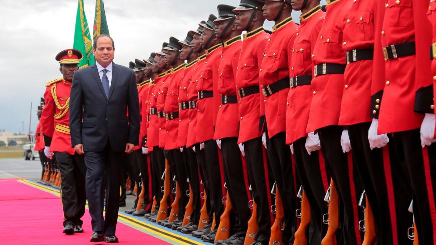 Egyptian President Abdel Fattah al-Sisi inspects a guard of honour upon arriving at the Julius Nyerere International Airport in Dar es Salaam, Tanzania August 14, 2017. REUTERS/Emmanuel Herman - RTS1BQZO