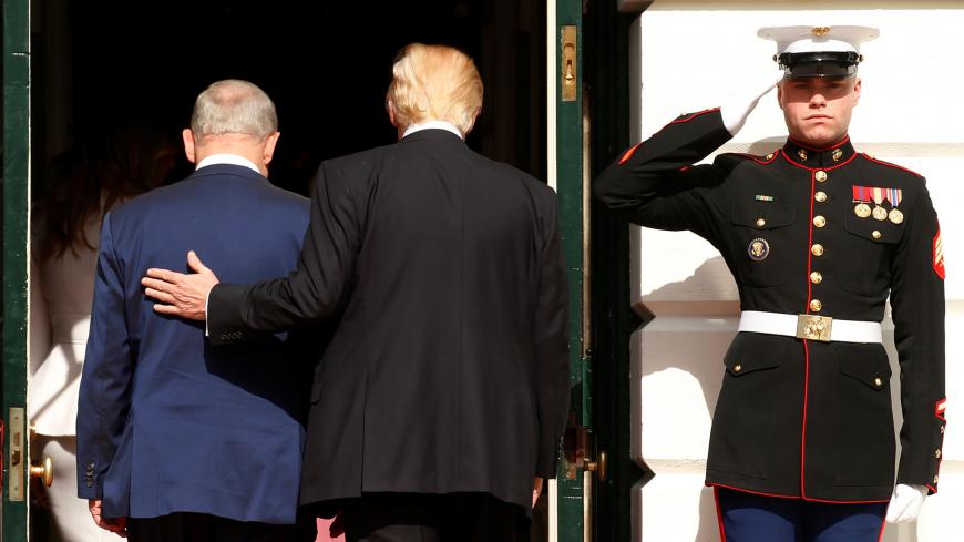 U.S. President Donald Trump (R) escorts Israeli Prime Minister Benjamin Netanyahu into the White House in Washington, U.S., February 15, 2017.REUTERS/Kevin Lamarque - RTSYUJN