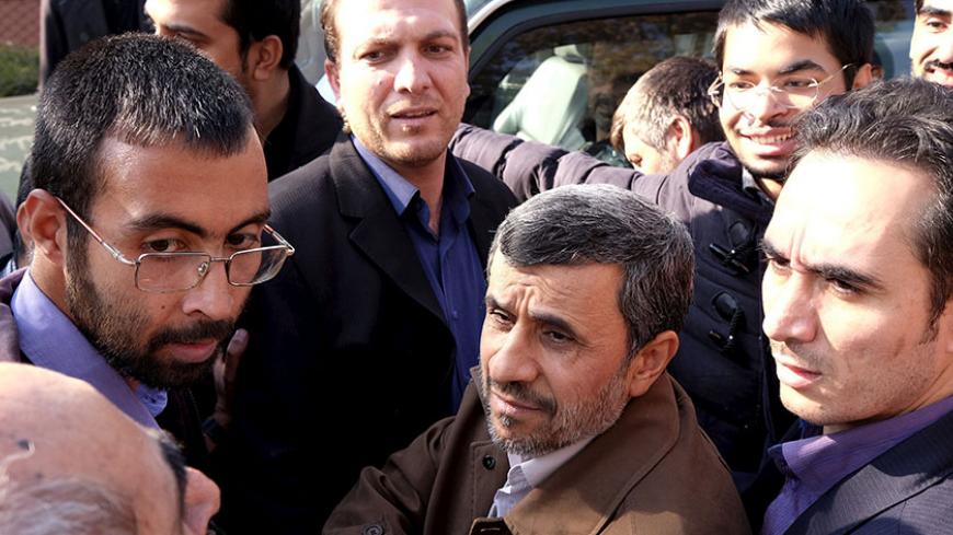 Former Iranian President Mahmoud Ahmadinejad (C front) listens to his supporters during the funeral ceremony of Iran's Ambassador to Lebanon Ghazanfar Roknabadi, who was killed in Saudi Arabia in a stampede at the haj pilgrimage, after Friday prayer in Tehran November 27, 2015. REUTERS/Raheb Homavandi/TIMA  ATTENTION EDITORS - THIS IMAGE WAS PROVIDED BY A THIRD PARTY. FOR EDITORIAL USE ONLY.  - RTX1W3E5