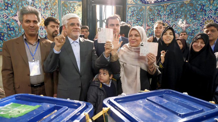 Iranian former vice president and candidate for parliamentary election Mohammad Reza Aref and his wife show their ink-stained fingers after casting their ballots during elections for the parliament and Assembly of Experts, which has the power to appoint and dismiss the supreme leader, in Tehran February 26, 2016.  REUTERS/Raheb Homavandi/TIMA  ATTENTION EDITORS - THIS IMAGE WAS PROVIDED BY A THIRD PARTY. FOR EDITORIAL USE ONLY. - GF10000324077