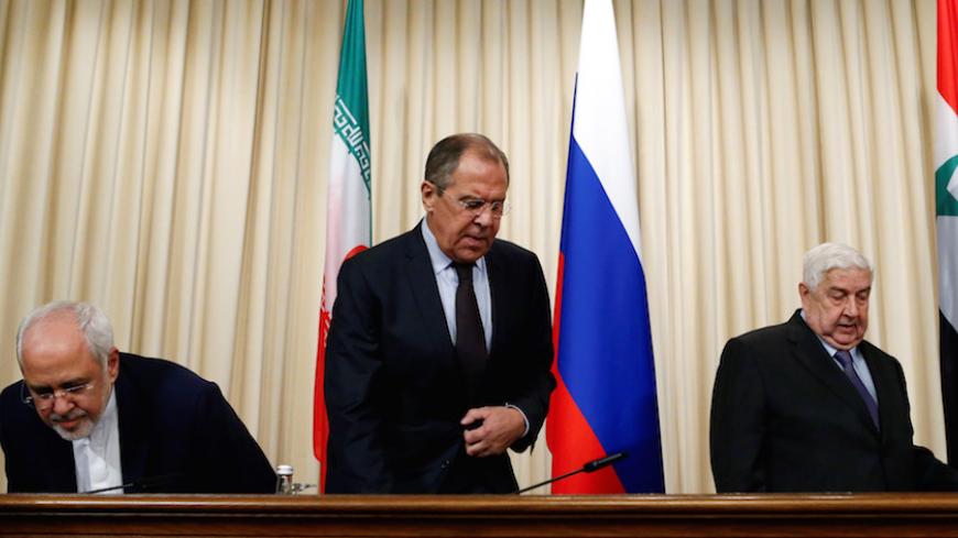 Russian Foreign Minister Sergei Lavrov (C), Syrian Foreign Minister Walid al-Muallem (R) and Iranian Foreign Minister Mohammad Javad Zarif attend a news conference in Moscow, Russia, October 28, 2016. REUTERS/Sergei Karpukhin     TPX IMAGES OF THE DAY      - RTX2QTRQ