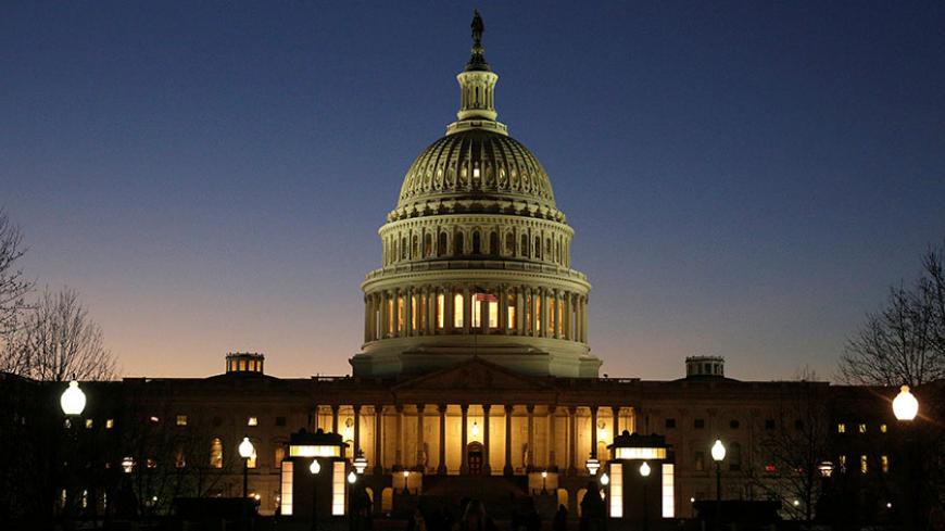The U.S. Capitol Building is lit at sunset in Washington, U.S., December 20, 2016.  REUTERS/Joshua Roberts - RTX2VXTZ