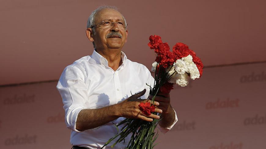 Kemal Kilicdaroglu, leader of main opposition Republican People's Party (CHP), greets people during a rally to mark the end of his 25-day long protest, dubbed "Justice March", against the detention of the party's lawmaker Enis Berberoglu, in Istanbul, Turkey July 9, 2017. REUTERS/Umit Bektas - RTX3AQU1